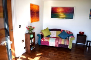 The lounge area with colourful paintings