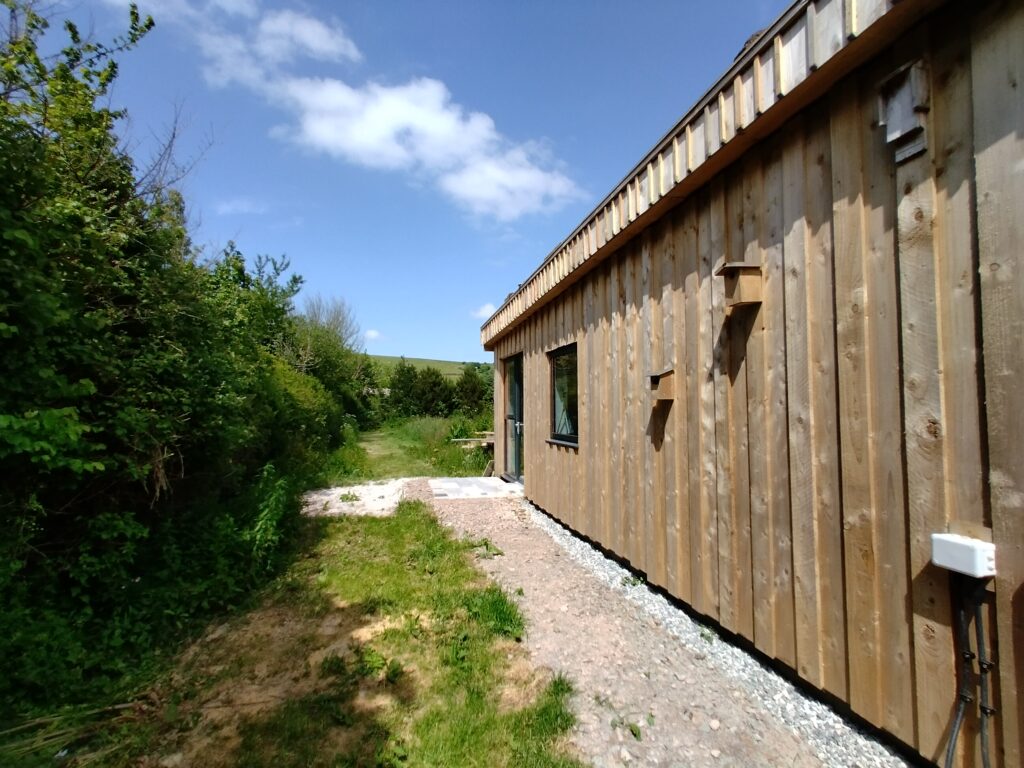 Walk down the side of the house to the fields.