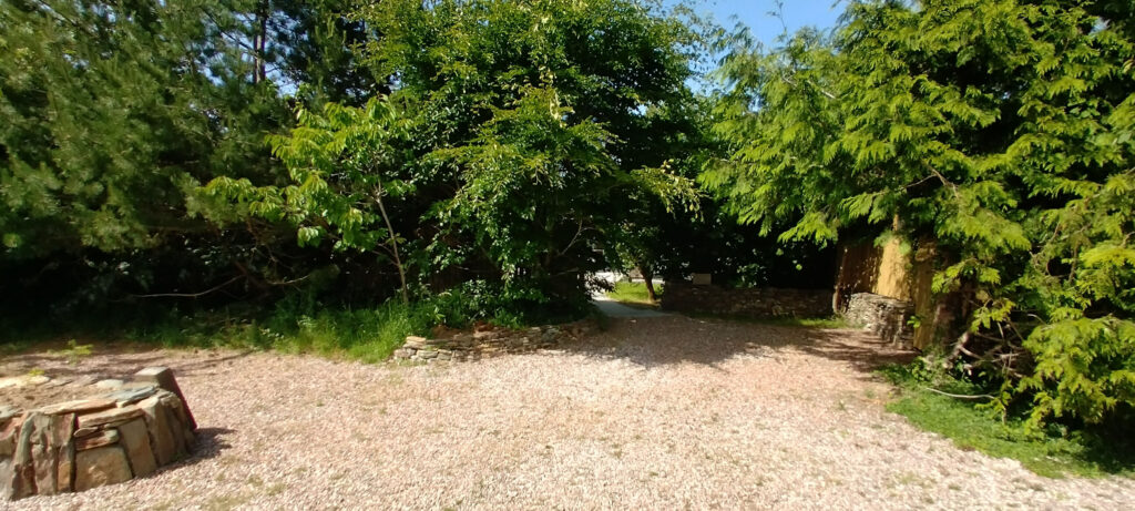 Plenty of Parking outside the House. The house is behind the trees
