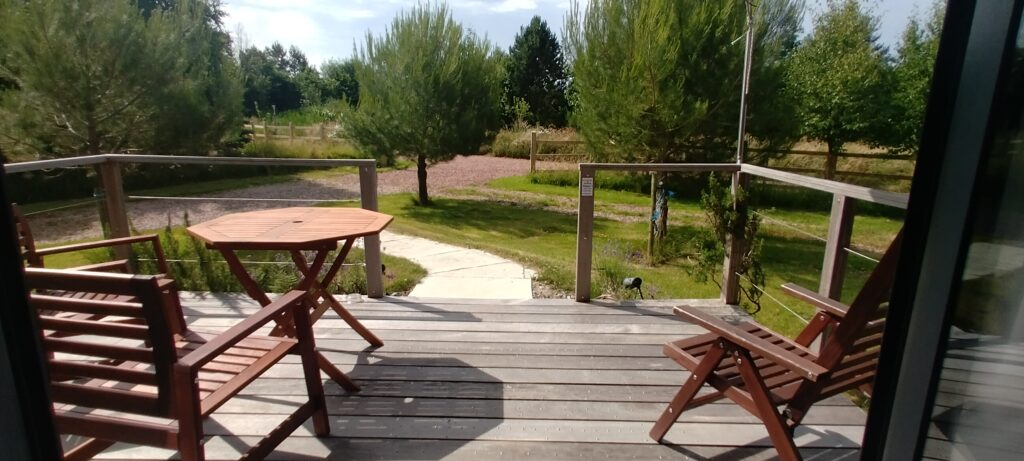 Lodge 2 deck with the trees and the flower meadow beyond