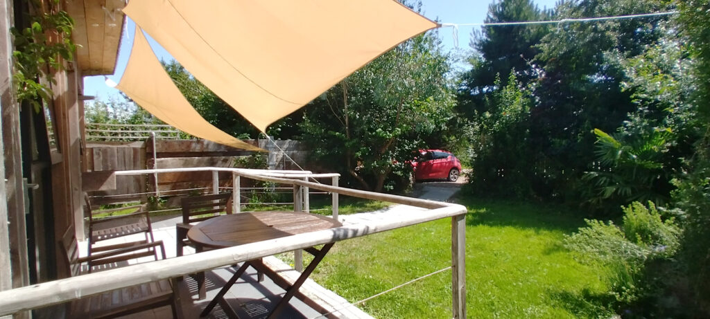 Sitting in the sun under the shade sails
